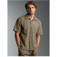 Trigema Blusenshirt TRIGEMA Polohemd in Waffel-Optik (1-tlg)