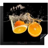 MuchoWow Herd-Abdeckplatte Orange - Stillleben - Wasser - Schwarz - Obst, Vinyl, (1 tlg), Abdeckplatte für Ceranfeld, Herd Inductionsmatte, 57.6x51.6 cm