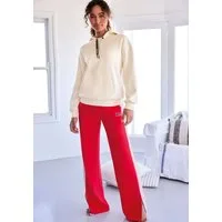 Bench. Loungewear Loungehose mit Seitenschlitzen am Beinsaum und Silikon Logo Badge, Loungewear