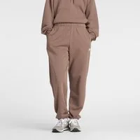 New Balance Jogginghose SPORT ESSENTIALS FRENCH TERRY JOGGER lockere Passform, aus Baumwolle und Polyester