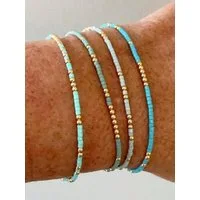 The Beauty House Armband 4 Stück Handgefertigte Stretch-Armbänder mit türkisfarbenen Perlen, – boho-inspirierter Schmuck für den Strand