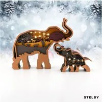 Stelby Dekofigur Tischdekoration Elefant Holzmodell LED mit Lichtern (2er-Set Elefanten Figuren, LED-Beleuchtung mit 3 Leuchtmodi für stimmungsvolle Atmosphäre), Hochwertiges Buchsbaumholz, fein verarbeitet mit natürlicher Maserung.