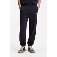 HUGO Sweathose Nevatro Regular Fit, Zierhosenschlitz, elastische Bündchen