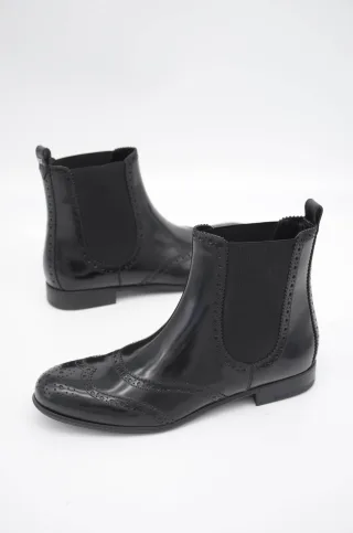 Dolce Gabbana Schwarze knöchelhohe flache Stiefel aus Leder