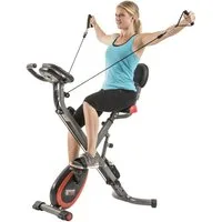 MOTIVE FITNESS by U.N.O. Heimtrainer Multi-Function X-BIKE (mit/ohne Unterlegmatte) (inkl. Seilzug für Arme und Beine), 120 kg max. Benutzergewicht, klappbar, Fahrrad, 8 Widerstandsstufen