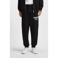 HUGO Jogginghose Nevez mit Beinbündchen und Oversize-Passform