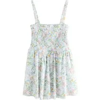 Next Badeanzug Formender, gesmokter Bandeau-Badeanzug mit Rock (1-St)